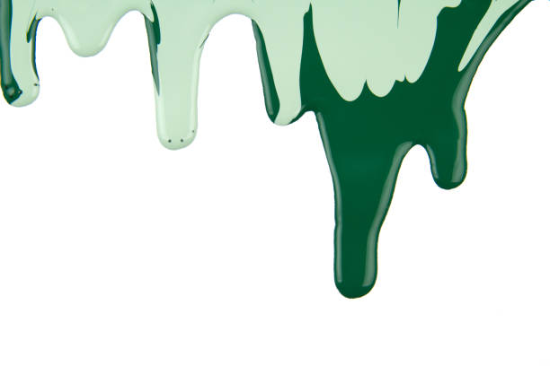 istock Abstract artistic paint Green color dripping over white background 1202578488