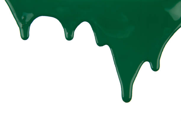 istock Abstract artistic paint Green color dripping over white background 1202578497