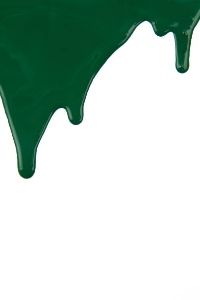 istock Abstract artistic paint Green color dripping over white background 1202578502