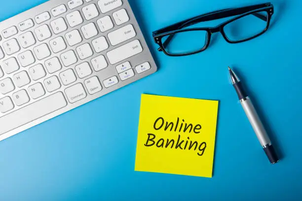 Photo of Online banking - electronic payment system connecting customers and bank or other financial institution