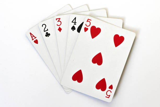 istock A straight poker hand with playing cards, different suits 1202579040