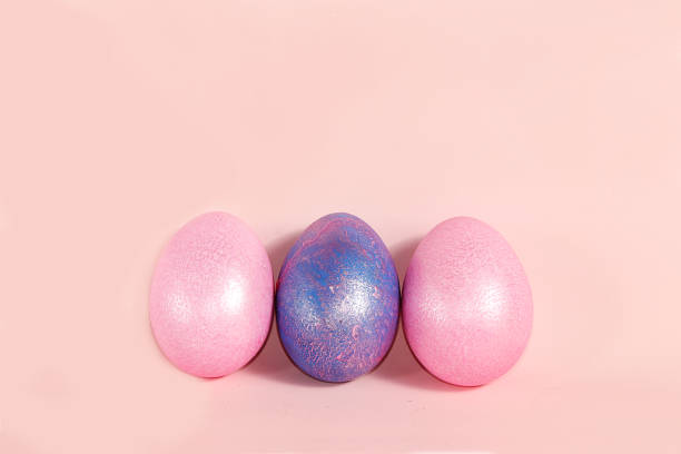 istock Decorated golden easter eggs on a pink background. Minimal holiday concept. Happy easter background. Creative painting of eggs at home, the idea of simple drawings for coloring 1202579131