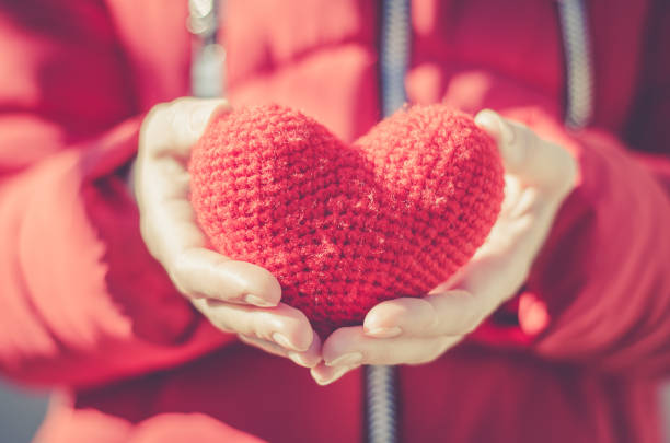 istock Girl holds a red heart. Valentine's Day Gift 1202579897