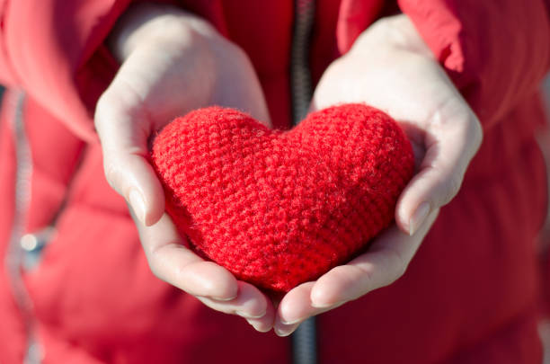 istock Girl holds a red heart. Valentine's Day Gift 1202579904
