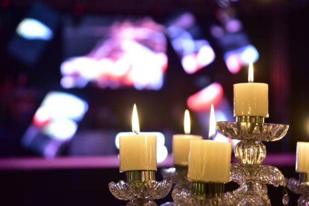 istock golden chandeliers with lighted candles on blurred background.. 1202581495