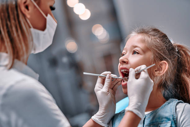 Viewed oral hygiene. Child to the dentist. Viewed oral hygiene. Child to the dentist. Child in the dental chair dental treatment during surgery. pediatric dentistry stock pictures, royalty-free photos & images