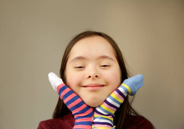 Beautiful girl smiling with different socks