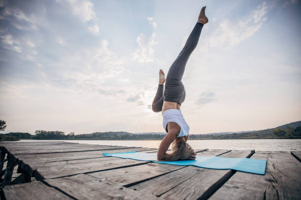 istock Woman doing yoga meditation 1202585618