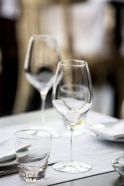 istock Wine glasses on the table in restaurant with decoration. Restaurant interior 1202586508