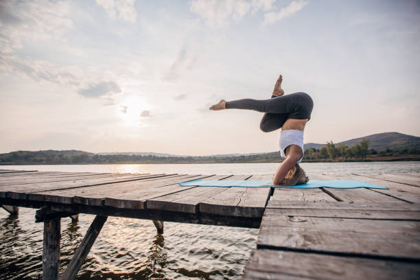 istock Beautiful woman doing yoga 1202586637