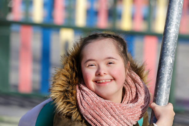 istock Nice girl having fun on the playground 1202587024