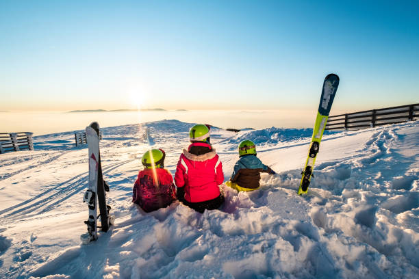 istock Mother with kids on skiing 1202587817