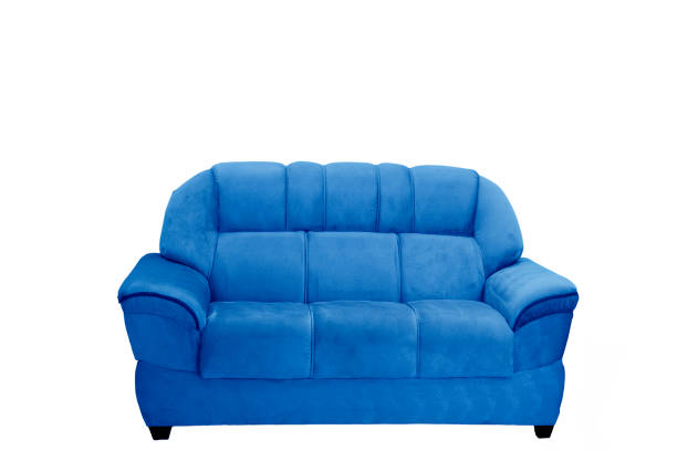 istock sofa, long soft comfortable pink chair isolated on blue background. 1202590891