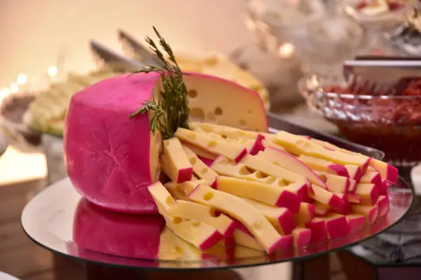 Photo of party table with gouda parmesan chees meadow freshness cut into strips with side view with blur in the photo