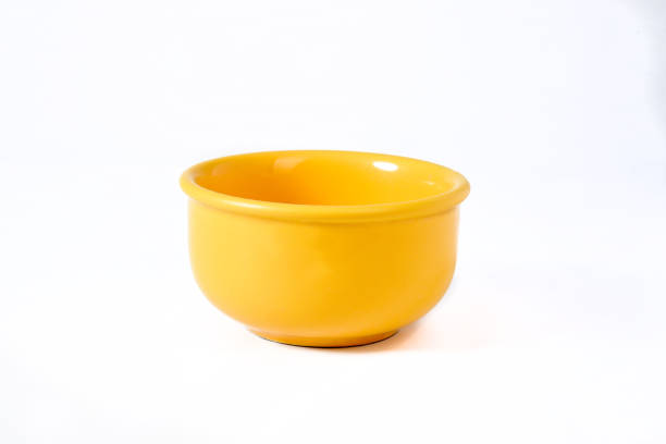 yellow bowl isolated on white background with space for text