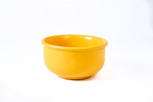 yellow bowl isolated on white background with space for text
