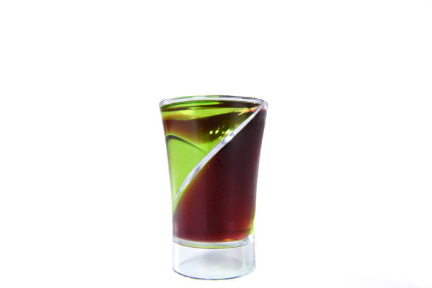 two color double alcoholic short drink isolated on white background