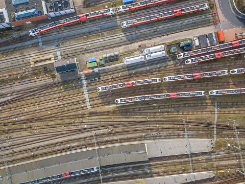 Railroad yard in Zwolle at the Engelse Werk park seen from above during a beautiful summer day. Trains are stationary at the yard for various lines in Overijssel.