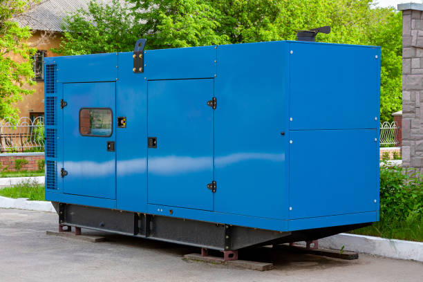 Diesel generator for emergency power supply at the wall of a medical center against the backdrop of green trees in fine weather. Diesel generator for emergency power supply at the wall of a medical center against the backdrop of green trees in fine weather. Close-up generator stock pictures, royalty-free photos & images