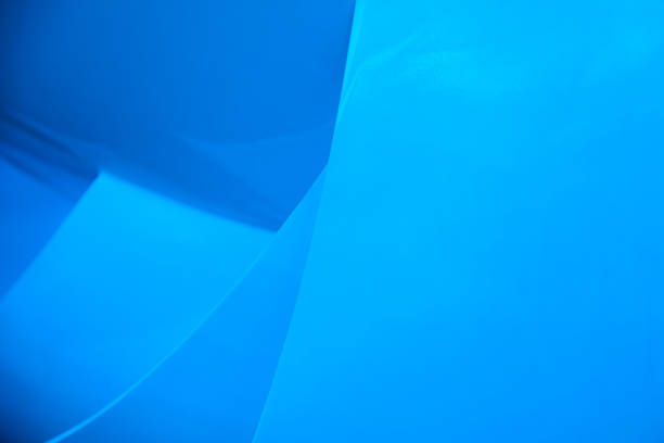 istock Blue abstract background of intersecting material planes. 1202591745
