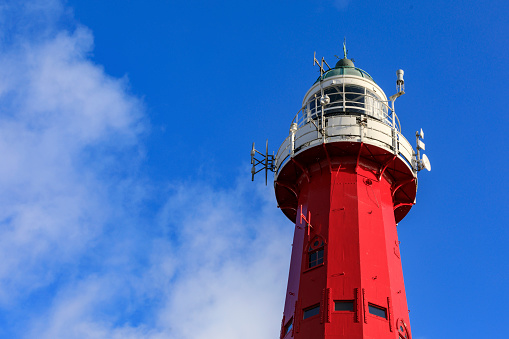 Scheveningen' lighthouse against a partly clouded sky; The Hague, Netherlands