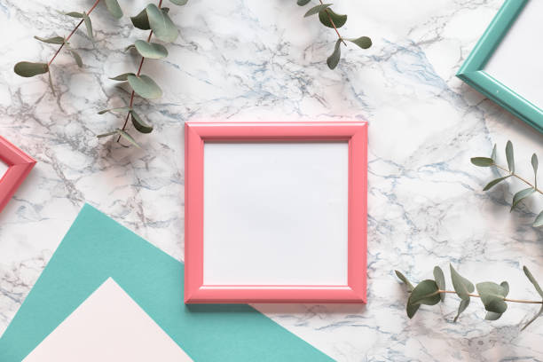 istock Flat lay, top view eucalyptus on marble background, light textured stone table surface. Trendy background with copy-space in pink frame. Beautiful abstract geometric floral background. 1202594808