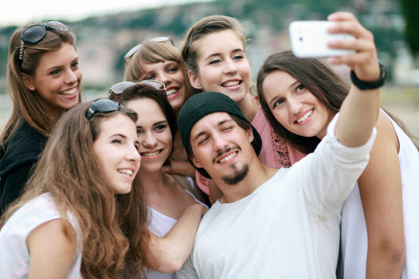 istock Group of young people taking selfie 1202596293
