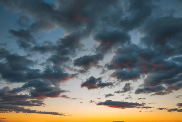 istock An orange sky textured background. Vertical orientation 1202598555