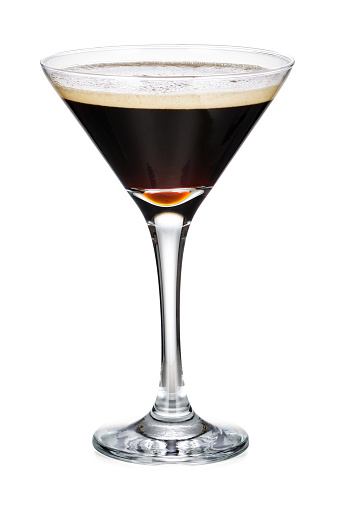 Vidrio Martini con café negro aislado sobre fondo blanco photo