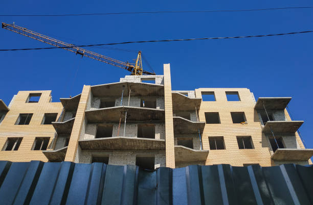 istock Aerial Building Process of Construction Site. Engineers crane and city. 1202601006