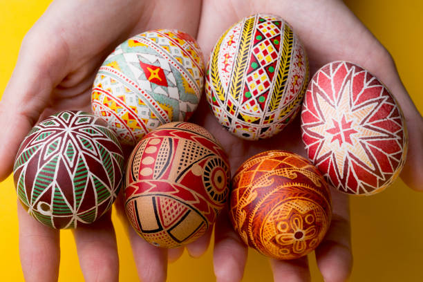 istock happy easter card. beautiful Easter egg Pysanka handmade - ukrainian traditional on a red background
