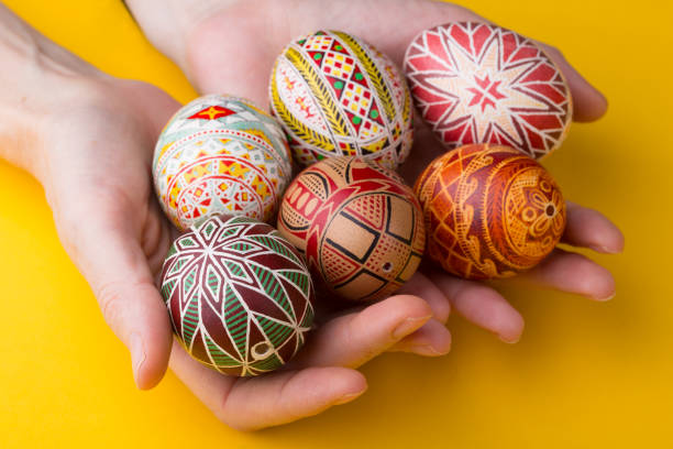 istock happy easter card. beautiful Easter egg Pysanka handmade - ukrainian traditional on a red background