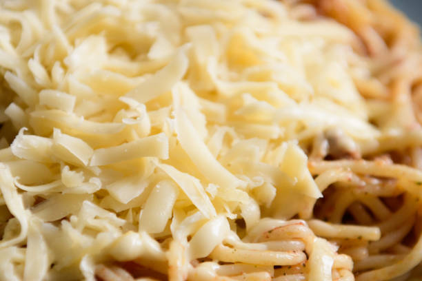 istock Cheese on pasta with meat, pasta on a blue plate 1202605546