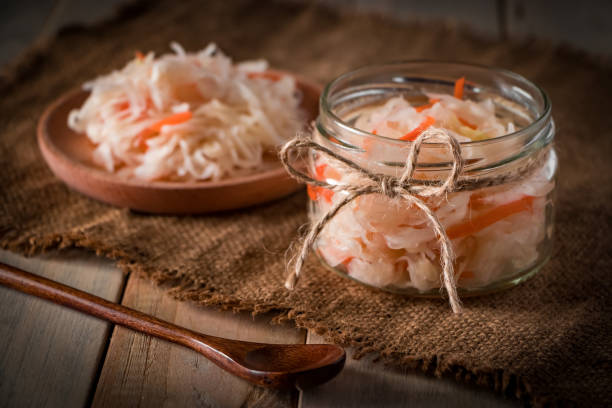 istock Homemade sauerkraut on a linen background. 1202610486