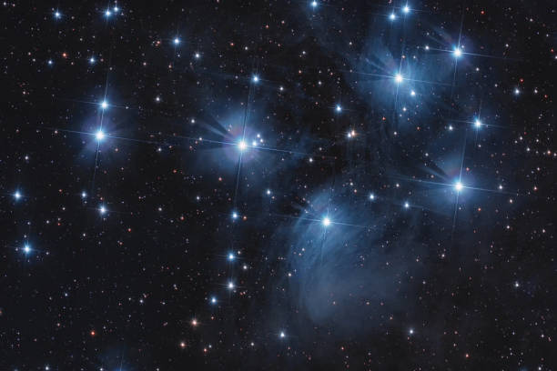 Pleiades in a starry night Playades asterism in taurus constellation during a winter starry night the pleiades stock pictures, royalty-free photos & images