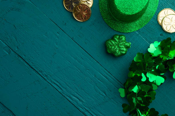 istock Traditional Irish holiday St. Patrick's Day, March 17th celebration, with accessories for teething on a green wooden background. 1202636392