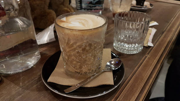 istock coffee cappuccino and heart on top , in coffee shop 1202638021
