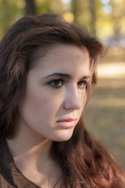 istock girl with brown eyes closeup 1202643974