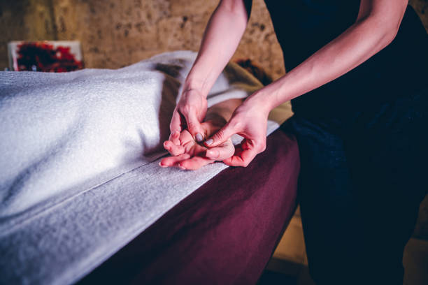istock Woman having hand massage 1202647789