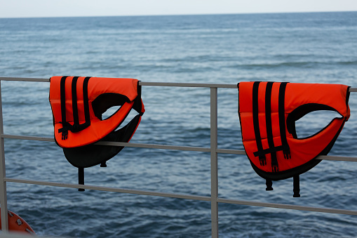 Close-up of sea life vests. Sea rescuers.