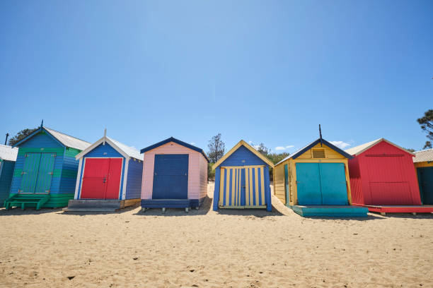 istock Brighton Beach huts/boxes on a blue sky sunny day with bright colours and textures 1202663700
