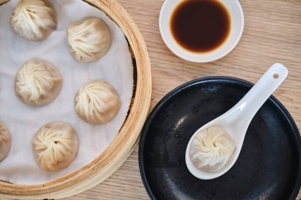 istock Fresh made steamed dumplings in asian restaurant in melbourne 1202663922