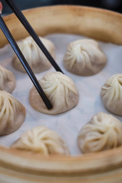 istock Fresh made steamed dumplings in asian restaurant in melbourne 1202664008