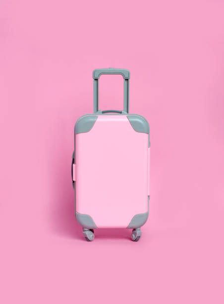 istock Pink suitcase on a pink background. Minimalism 1202665913