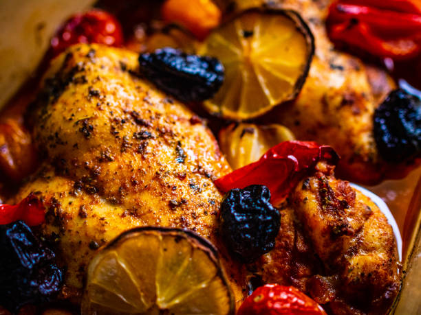 Fried chicken breast and vegetables in glass pot