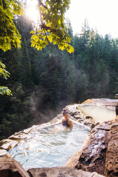 istock woman resting in an hot spring in oregon 1202672054