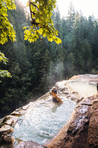istock woman resting in an hot spring in oregon 1202672144