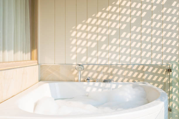 istock White bathtub and hot tub decoration interior 1202672289