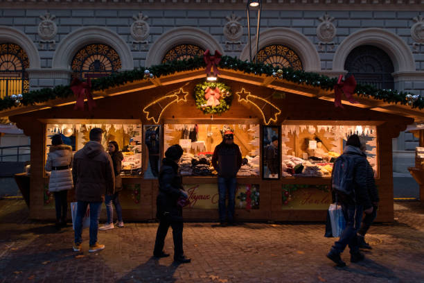 People shopping at food stalls in Christmas market in Bologna, Italy stock photo