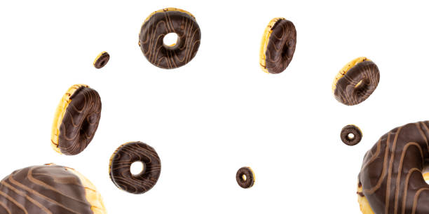 istock Flying cookie. Round sweet doughnuts in motion flying on white background 1202673143